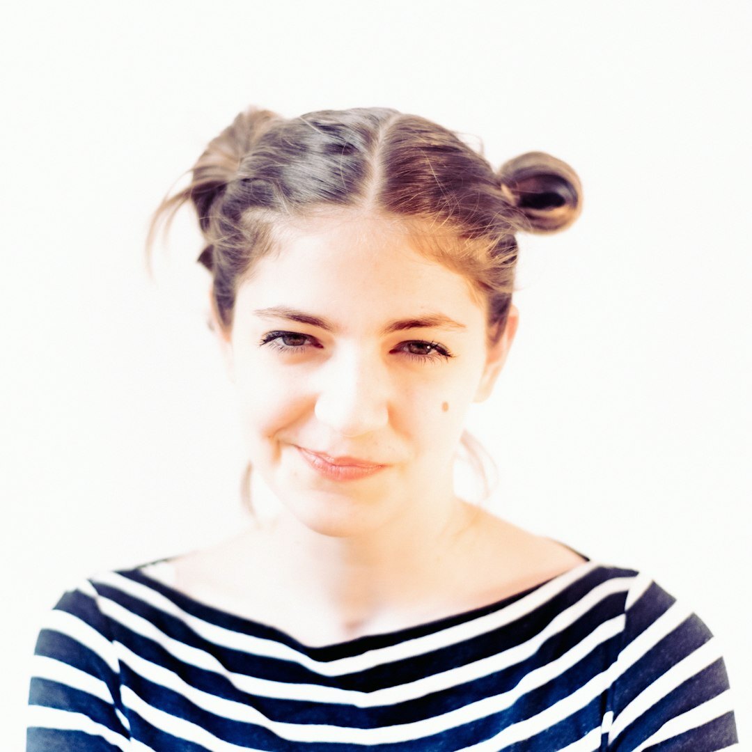 Professional headshot of female editor-in-chief journalist