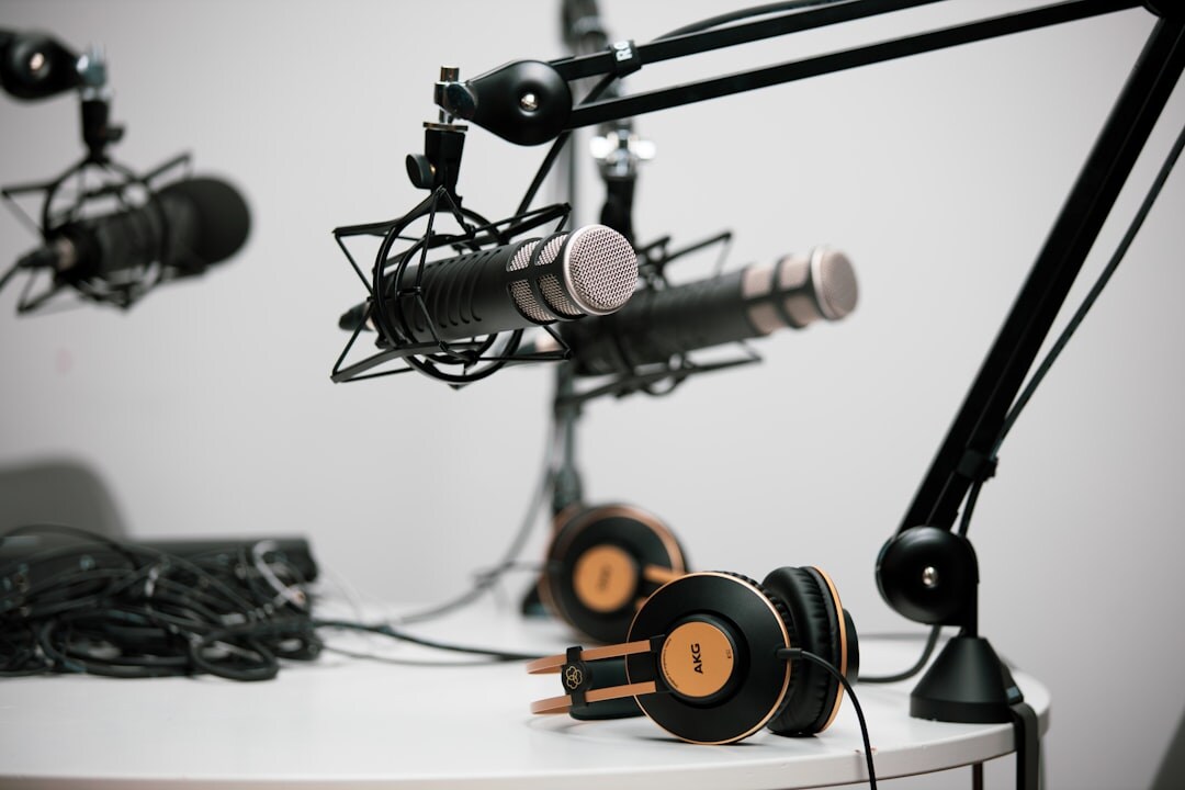 Radio broadcaster hosting live show with headphones and microphone