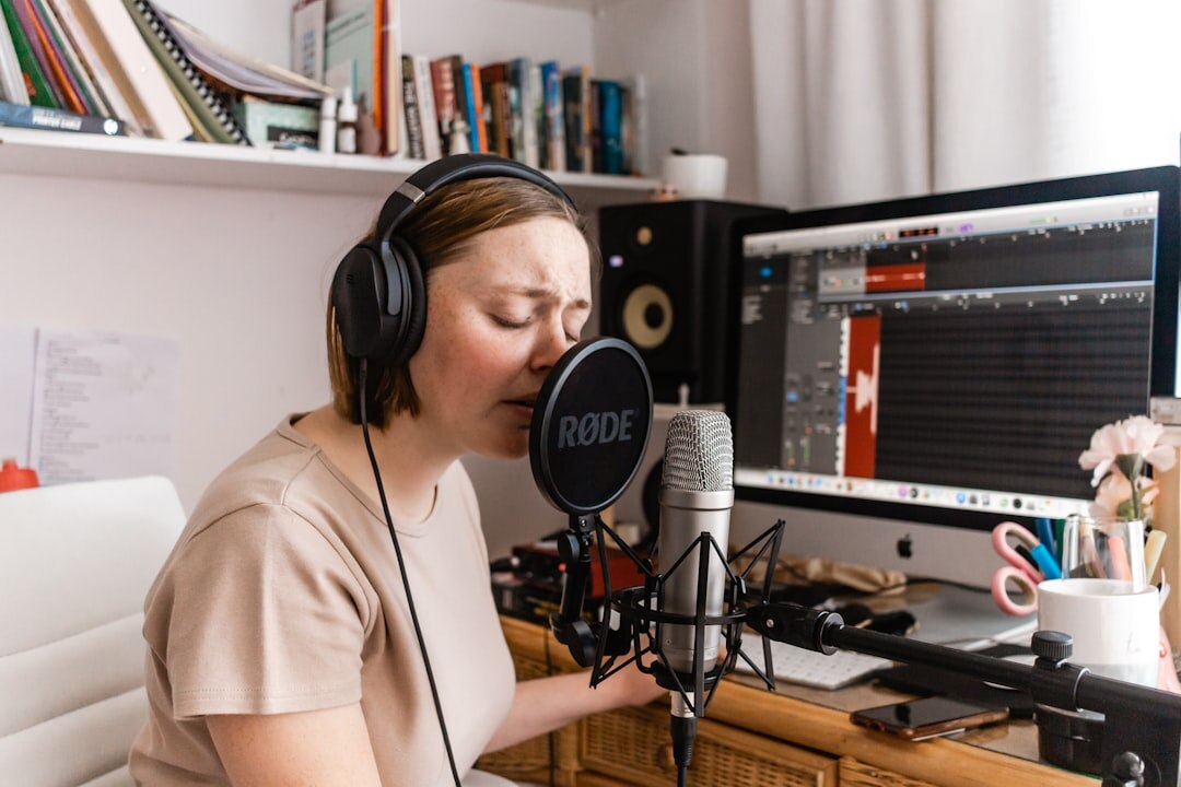 Radio broadcaster speaking into professional studio microphone