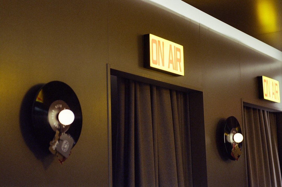 Radio station control room with professional mixing console and microphones